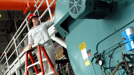 Industrial Assessment Center members conduct an energy audit on a boiler.