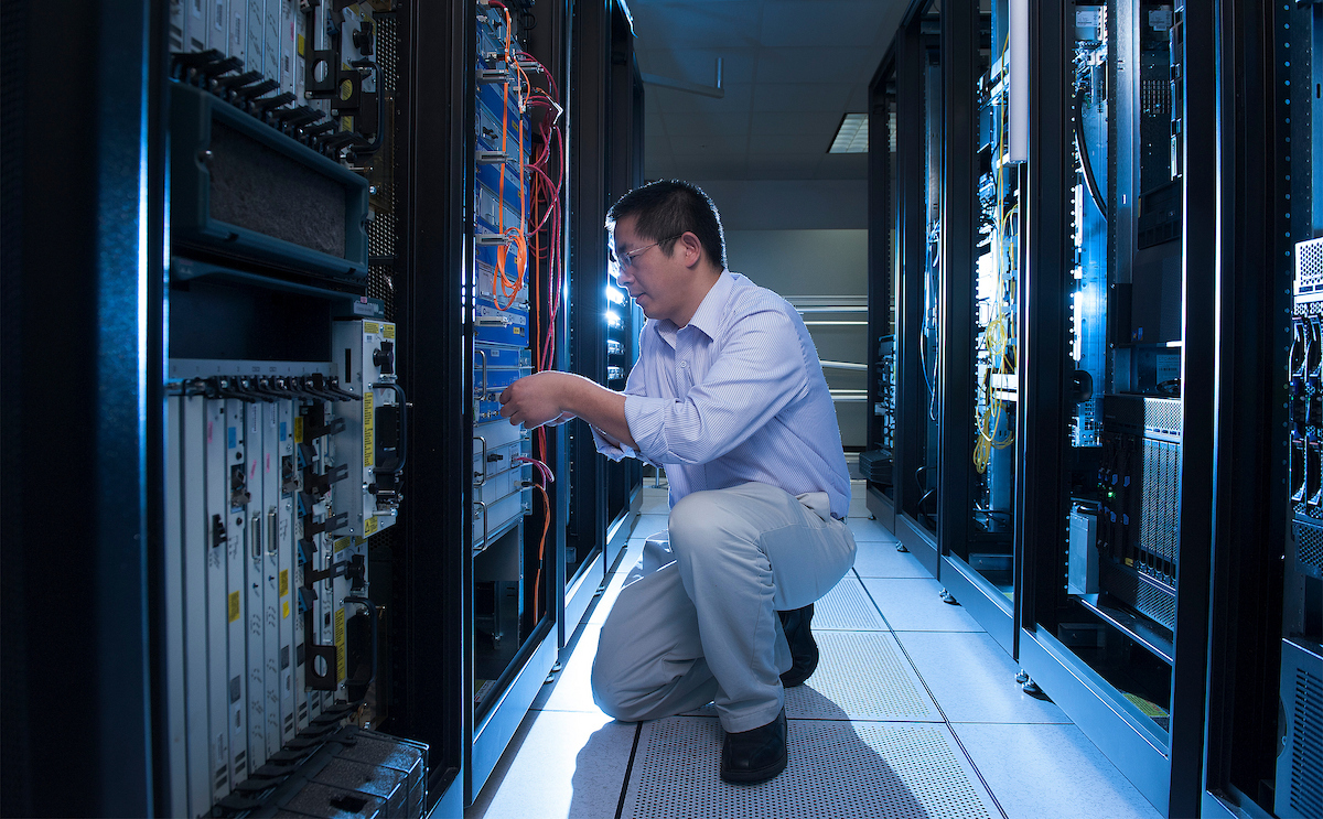 Xuxian Jiang inside of the OSCAR labs on Centennial Campus. He teaches computer science.